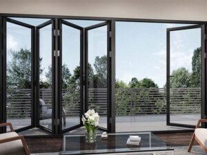 Bifold glass patio doors with black frames